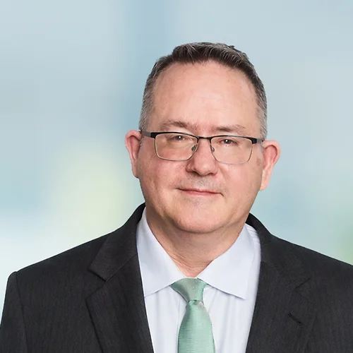 A photo of attorney Steven Dargitz against a softly blurred office background