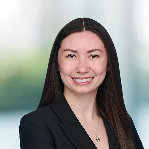 A photo of attorney Rebecca Love against a softly blurred office background