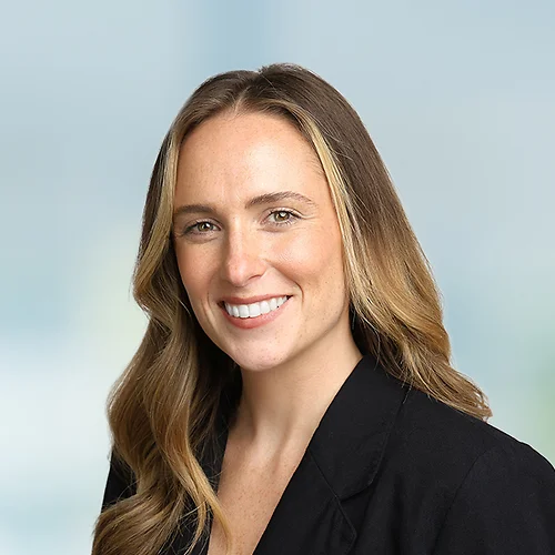 A photo of attorney Kathryn McCallion against a softly blurred office background