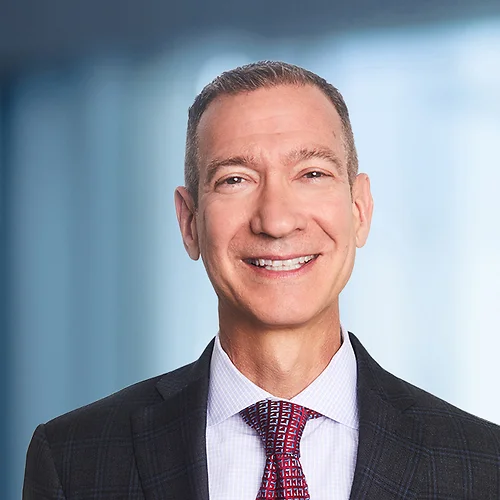 A photo of attorney Mike Sweeney against a softly blurred office background
