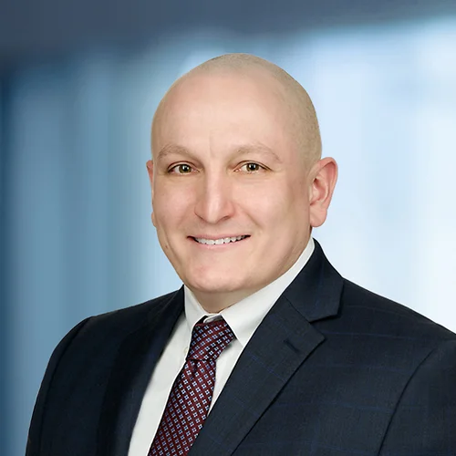 A photo of attorney James VanCamp against a softly blurred office background