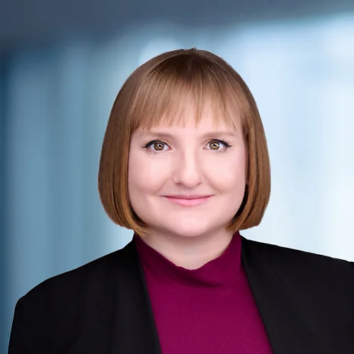 A photo of attorney Alexandra Boyer against a softly blurred office background
