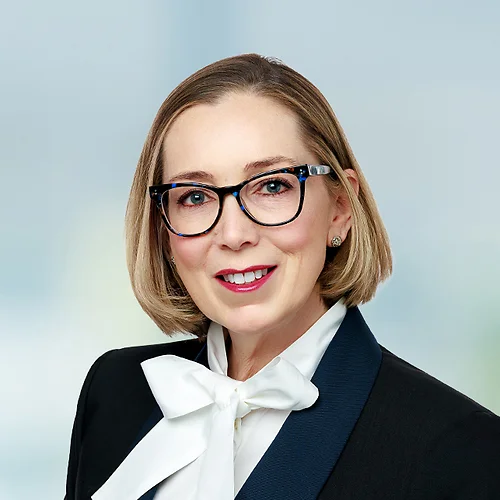 A photo of attorney Jade Butman against a softly blurred office background