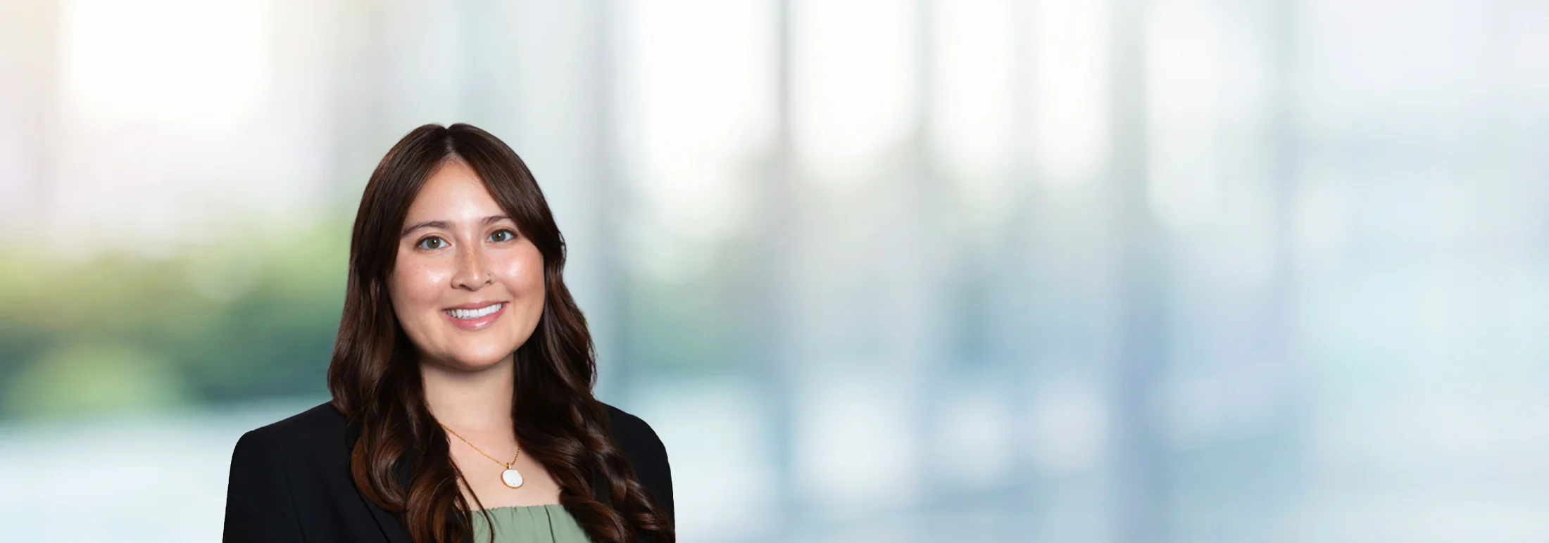 A photo of attorney Ashley Duke against a softly blurred office background
