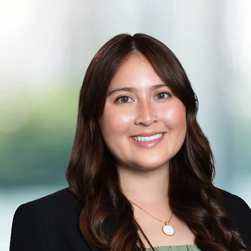 A photo of attorney Ashley Duke against a softly blurred office background