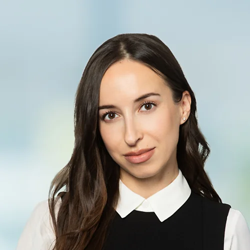 A photo of attorney Alina Goncharova against a softly blurred office background