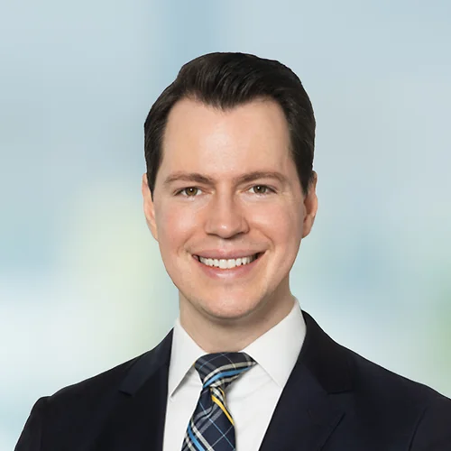 A photo of attorney Alexander Hawgood against a softly blurred office background