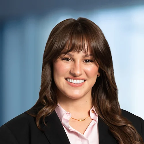 A photo of attorney, Emmy Hoskins, against a softly blurred office background