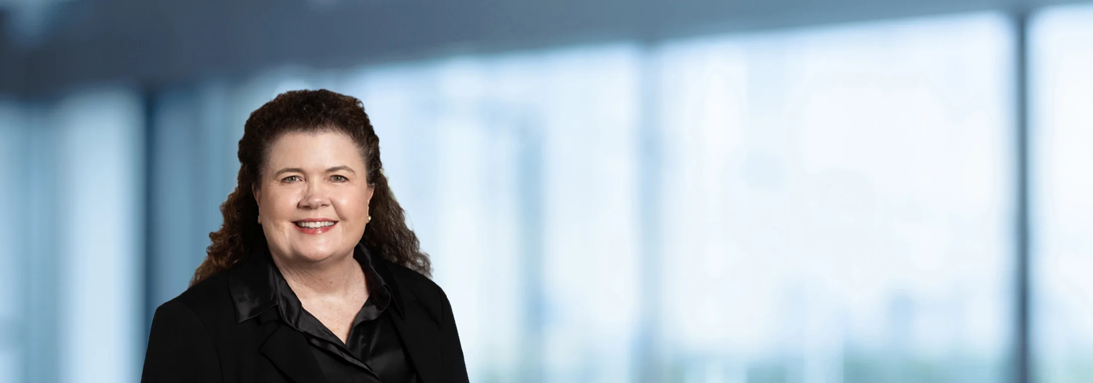 A photo of attorney Jill Johnson against a softly blurred office background