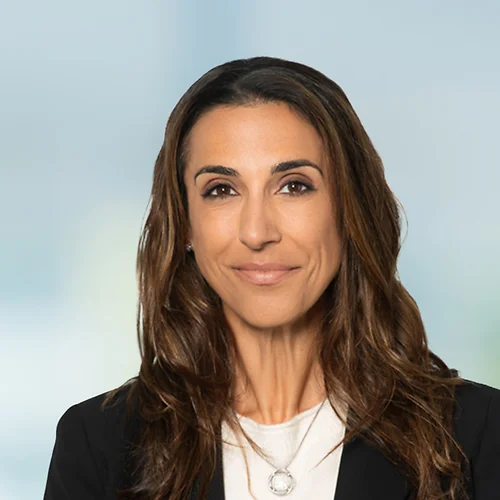 A photo of attorney Alaleh Khosrowpour against a softly blurred office background