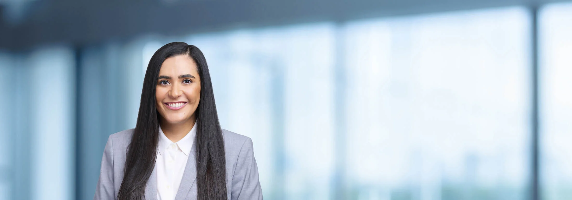 A photo of attorney Sohelia Mazdeh against a softly blurred office background
