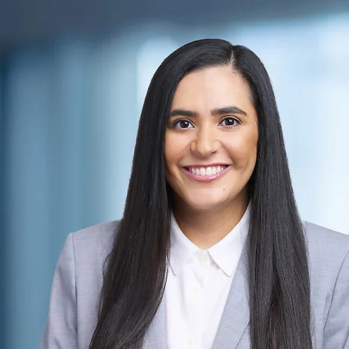 A photo of attorney Sohelia Mazdeh against a softly blurred office background