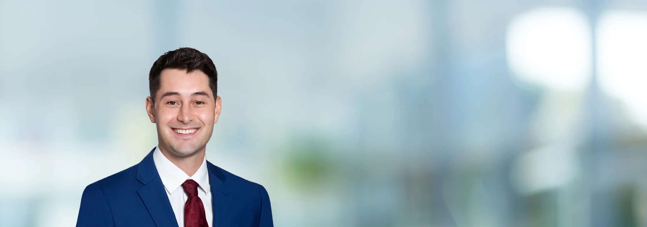 A photo of attorney Mitchell McCarthy against a softly blurred office background
