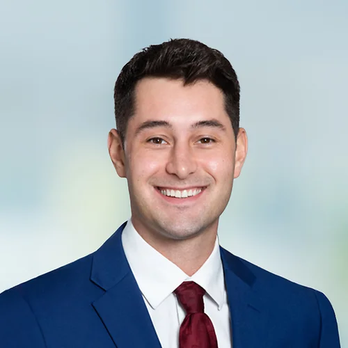 A photo of attorney Mitchell McCarthy against a softly blurred office background
