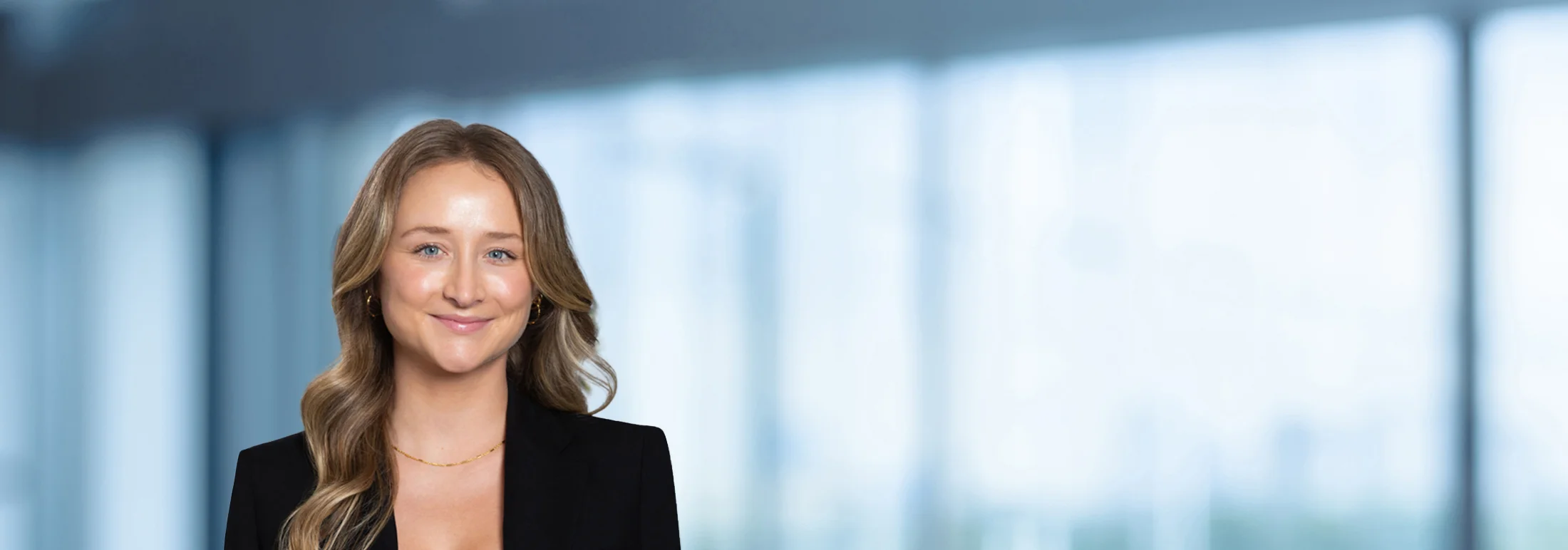 A photo of attorney Allison Miller against a softly blurred office background
