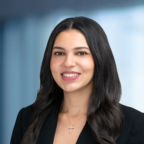 A photo of attorney Monica Mishriki against a softly blurred office background
