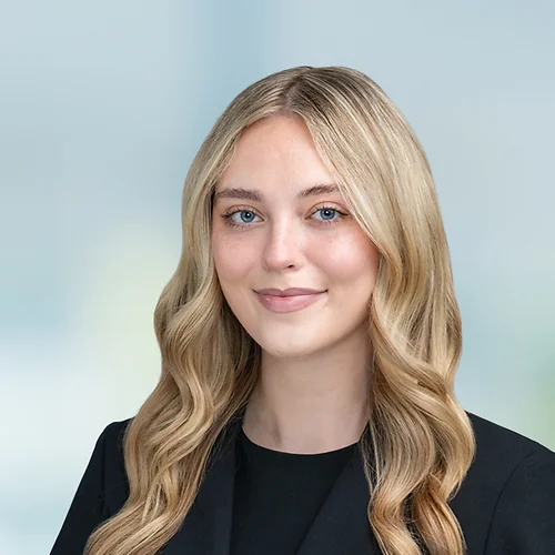 A photo of attorney Madison O'Neill against a softly blurred office background