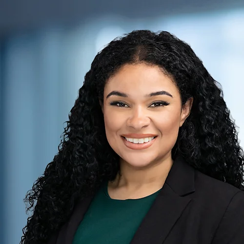 A photo of attorney Lauren Peterkin against a softly blurred office background