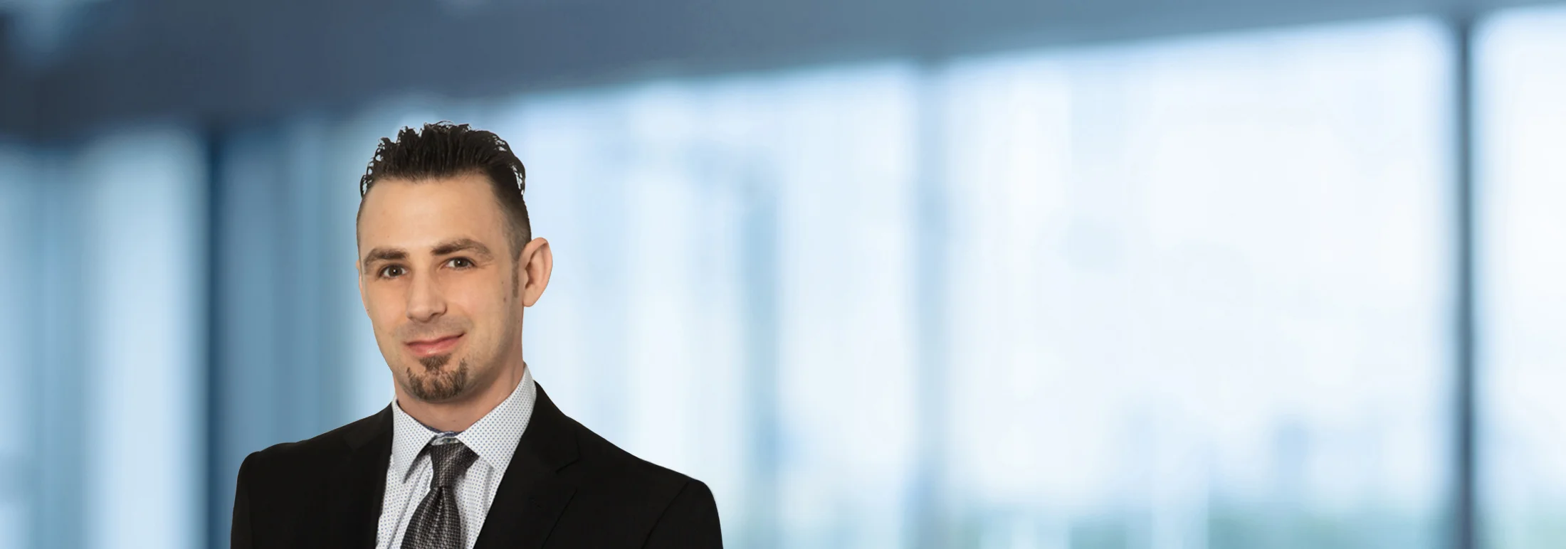A photo of attorney, William Richards, against a softly blurred office background