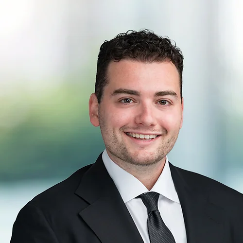 A photo of attorney Sean Stillman against a softly blurred office background