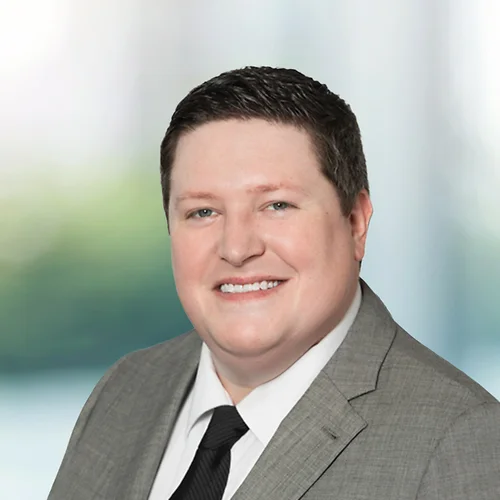 A photo of attorney Matthew Sullivan against a softly blurred office background
