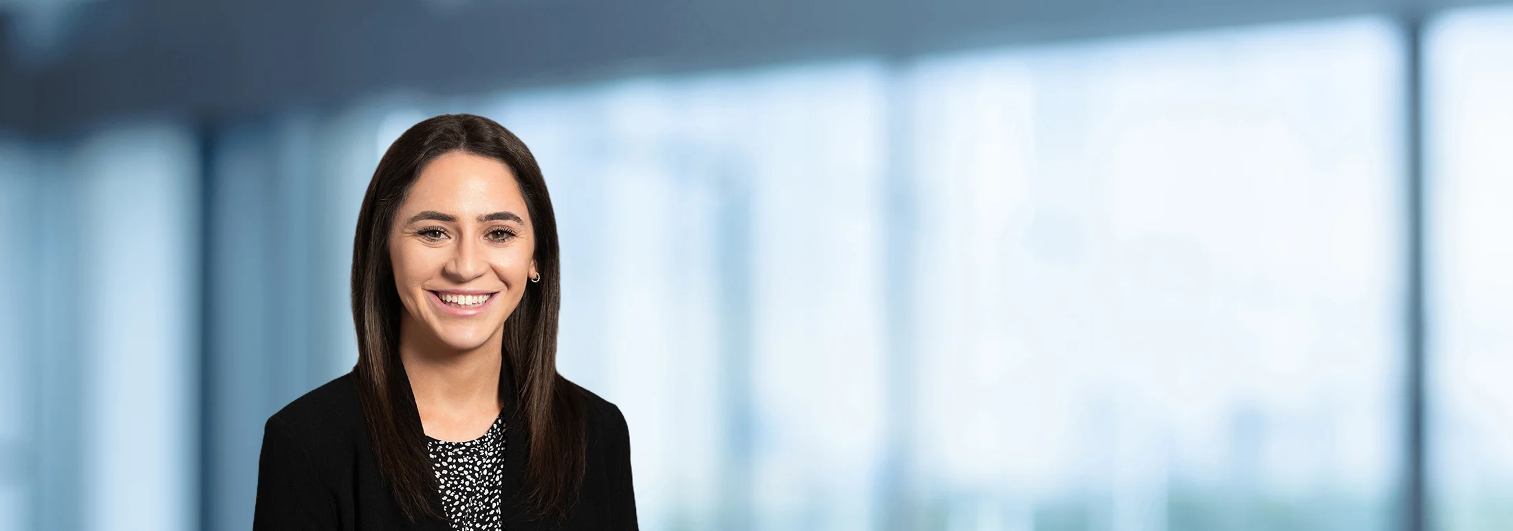 A photo of attorney Samantha Taubman against a softly blurred office background