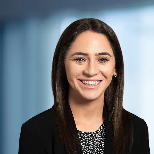 A photo of attorney Samantha Taubman against a softly blurred office background