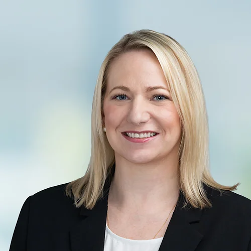 A photo of attorney Jessica Thompson against a softly blurred office background