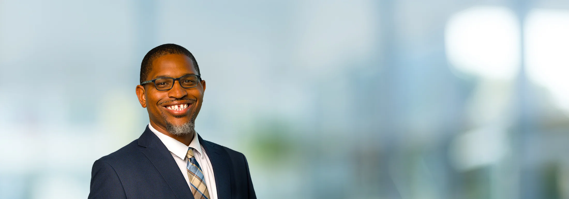 A photo of attorney, Michael Pierce, against a softly blurred office background