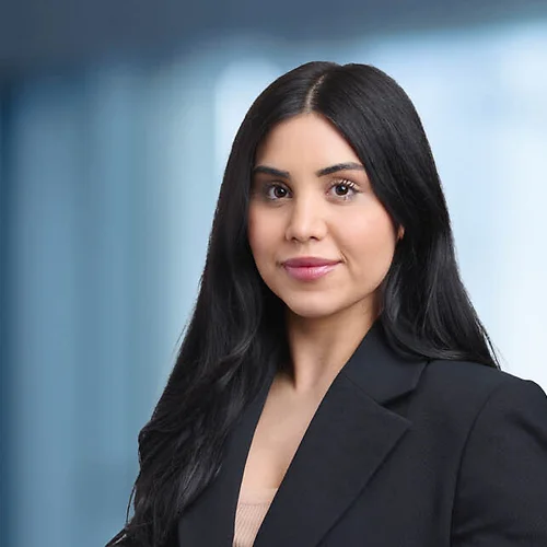 A photo of attorney Katrina Akbarian against a softly blurred office background