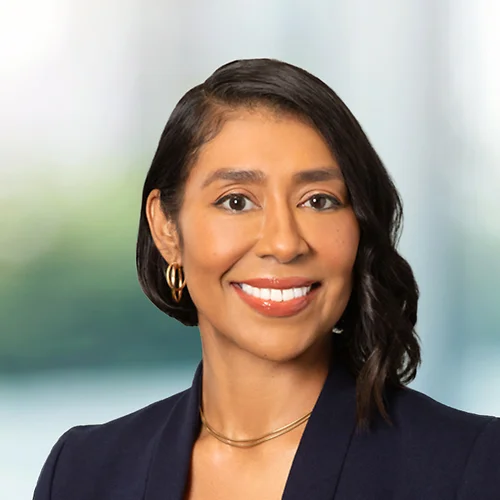A photo of attorney Kandice Canchan against a softly blurred office background