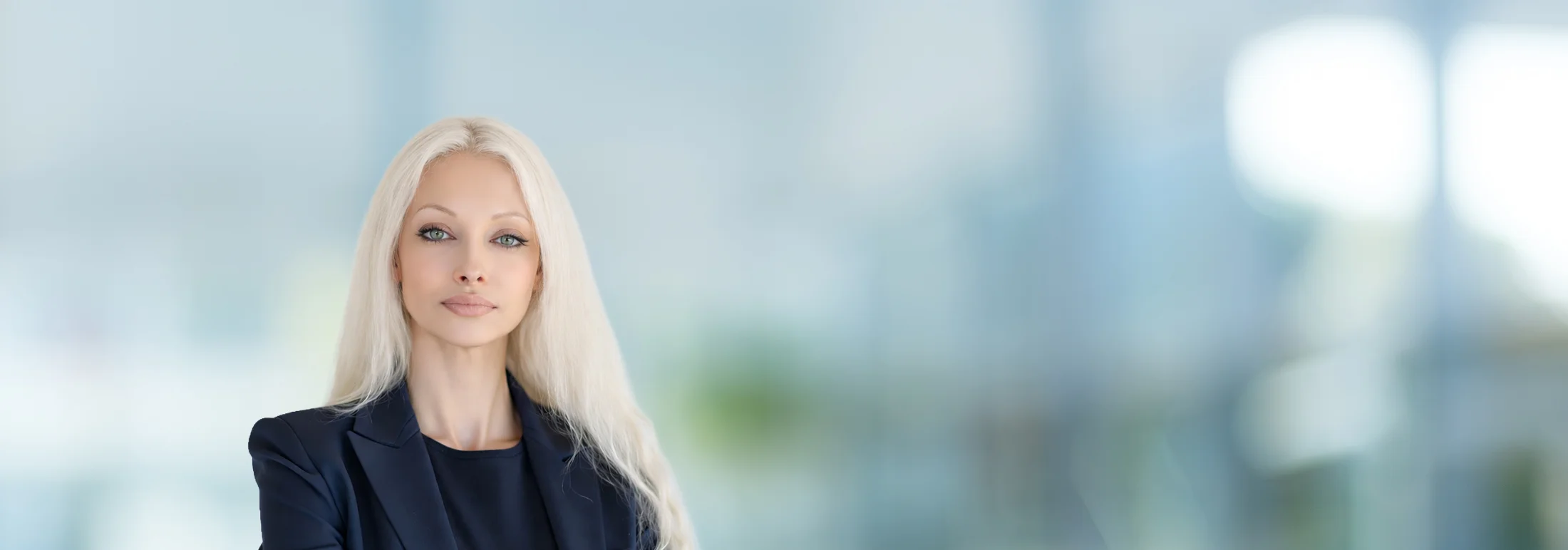 A photo of attorney Tatyana Esmailian against a softly blurred office background