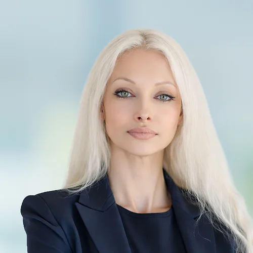 A photo of attorney Tatyana Esmailian against a softly blurred office background