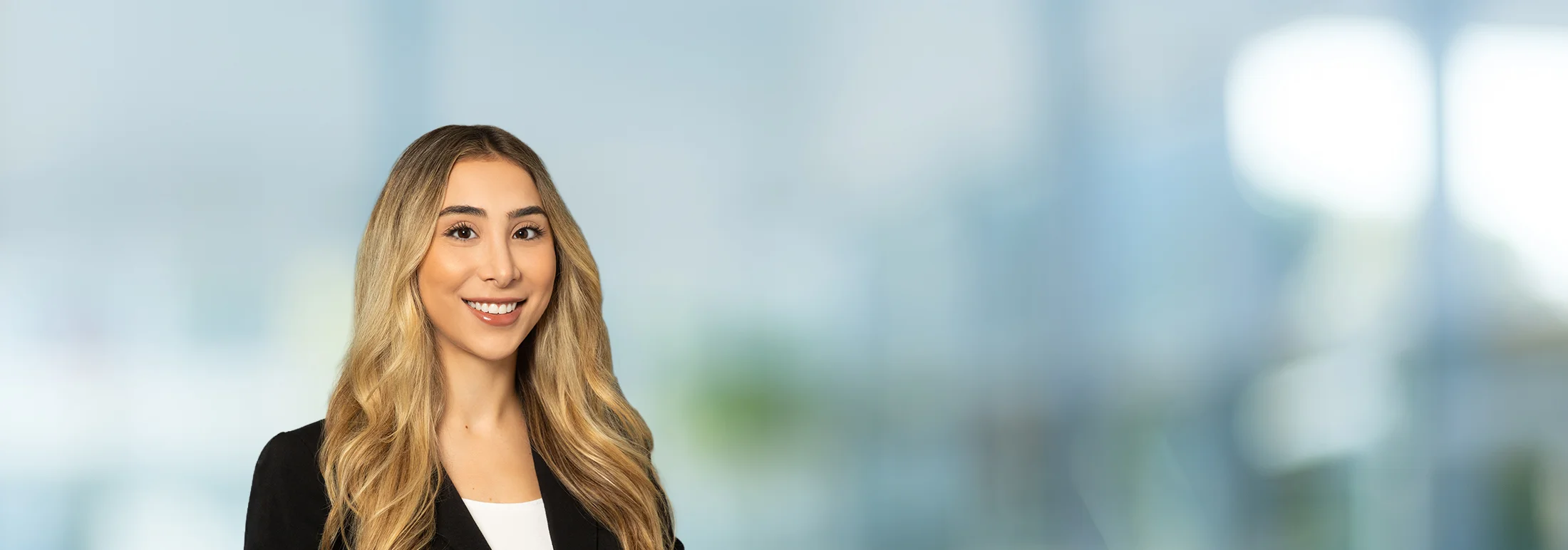 A photo of attorney Tatyana Matni against a softly blurred office background