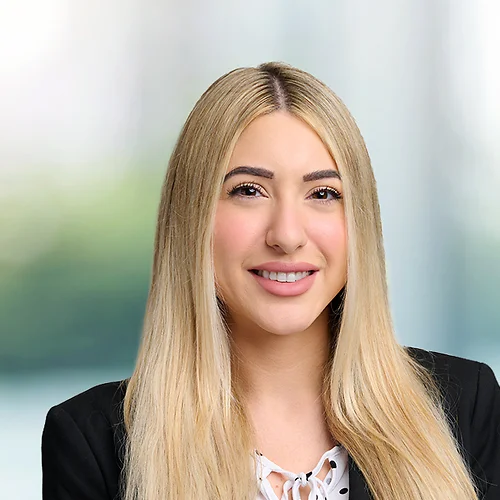 A photo of attorney Jasmine Ramezanzadeh against a softly blurred office background