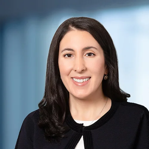 A photo of attorney Tiffany Rouhi against a softly blurred office background