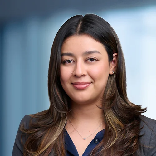 A photo of attorney Paulina Silva against a softly blurred office background