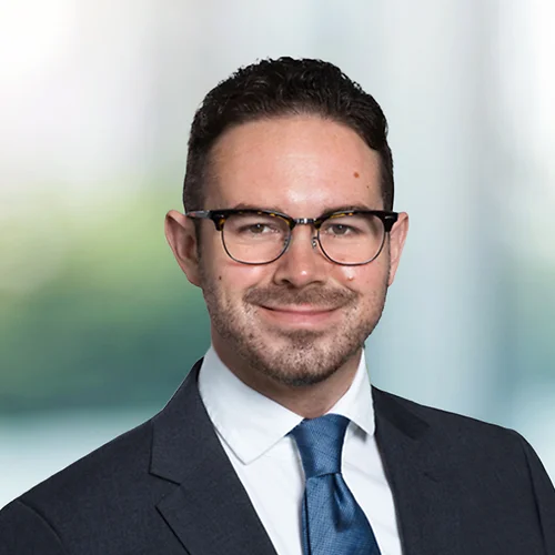 A photo of attorney Christopher Weinberger against a softly blurred office background