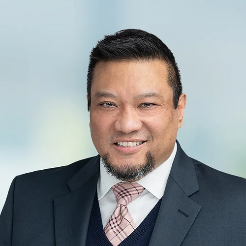 A photo of attorney Oscar Jimenez against a softly blurred office background