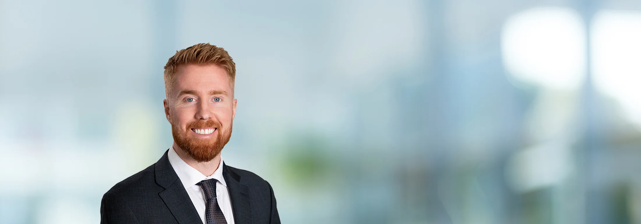 A photo of attorney Russell Kalvelage against a softly blurred office background
