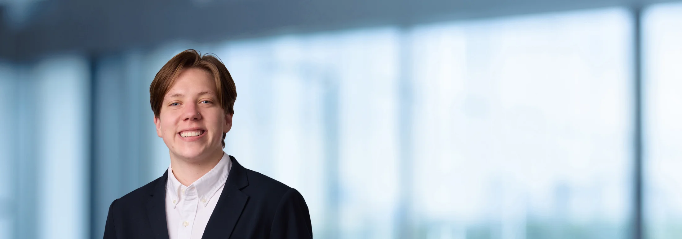 A photo of attorney Shannon Reny against a softly blurred office background