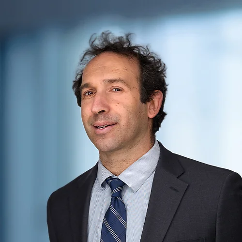 A photo of attorney David Lerch against a softly blurred office background
