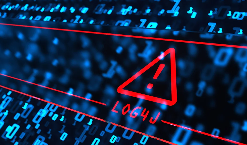 Close-up of a computer keyboard illuminated with blue backlighting, overlaid with a red triangular warning icon containing an exclamation mark. The glowing keys and digital styling create a high-tech atmosphere.