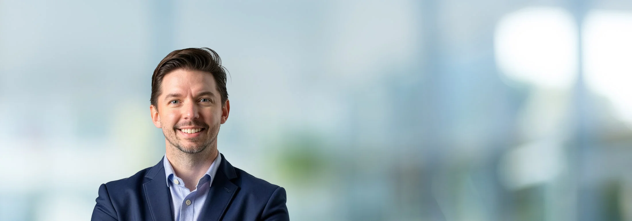 A photo of attorney Johnny Antwiler against a softly blurred office background