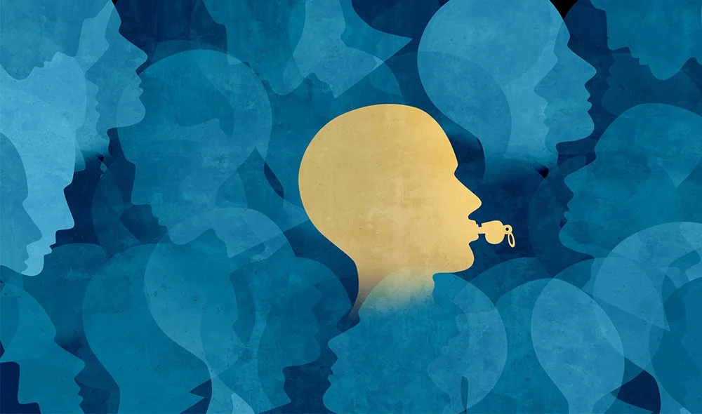 An abstract illustration featuring overlapping, textured shapes in various shades of blue filling the background. In the center, a single yellow silhouette of a human head faces to the right, standing out against the layered blue forms.