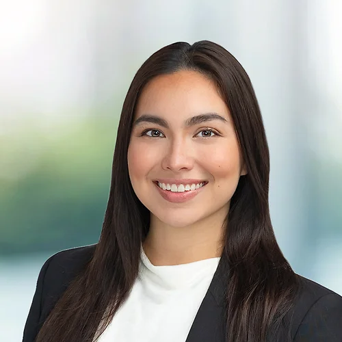 A photo of attorney Cresencia Meno against a softly blurred office background