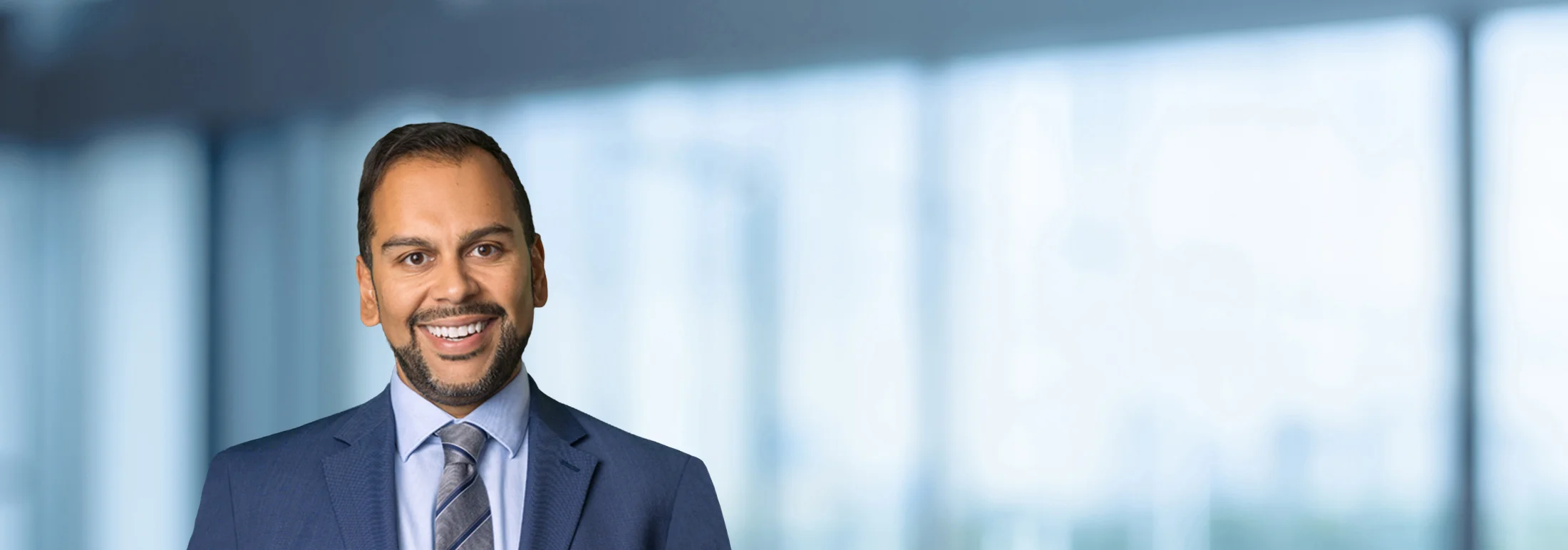 A photo of attorney Stephen Berrios against a softly blurred office background