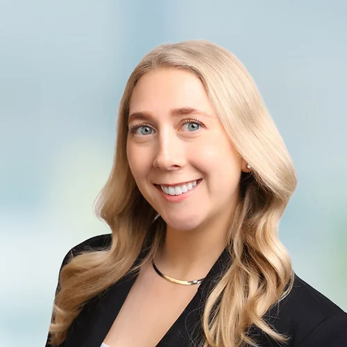A photo of attorney Anna Ludwick against a softly blurred office background