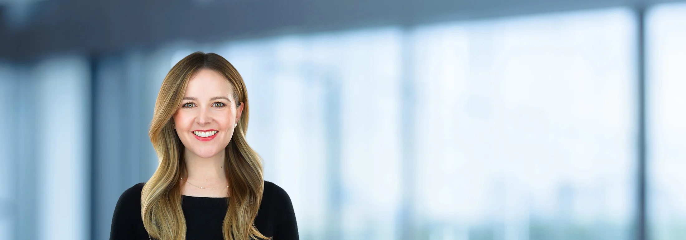 A photo of attorney, Alison Duffy, against a softly blurred office background.
