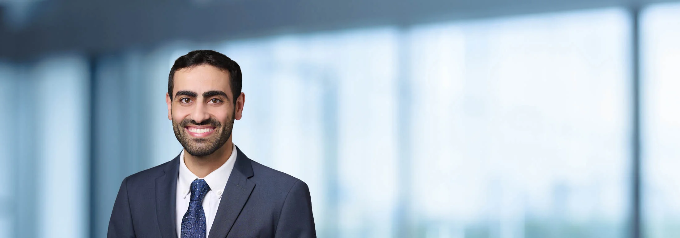 A photo of attorney Matthew Gundy against a softly blurred office background